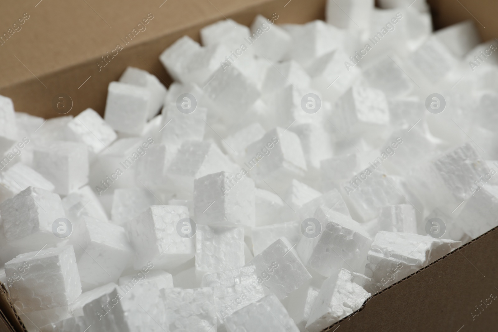 Photo of Closeup view of cardboard box with styrofoam cubes