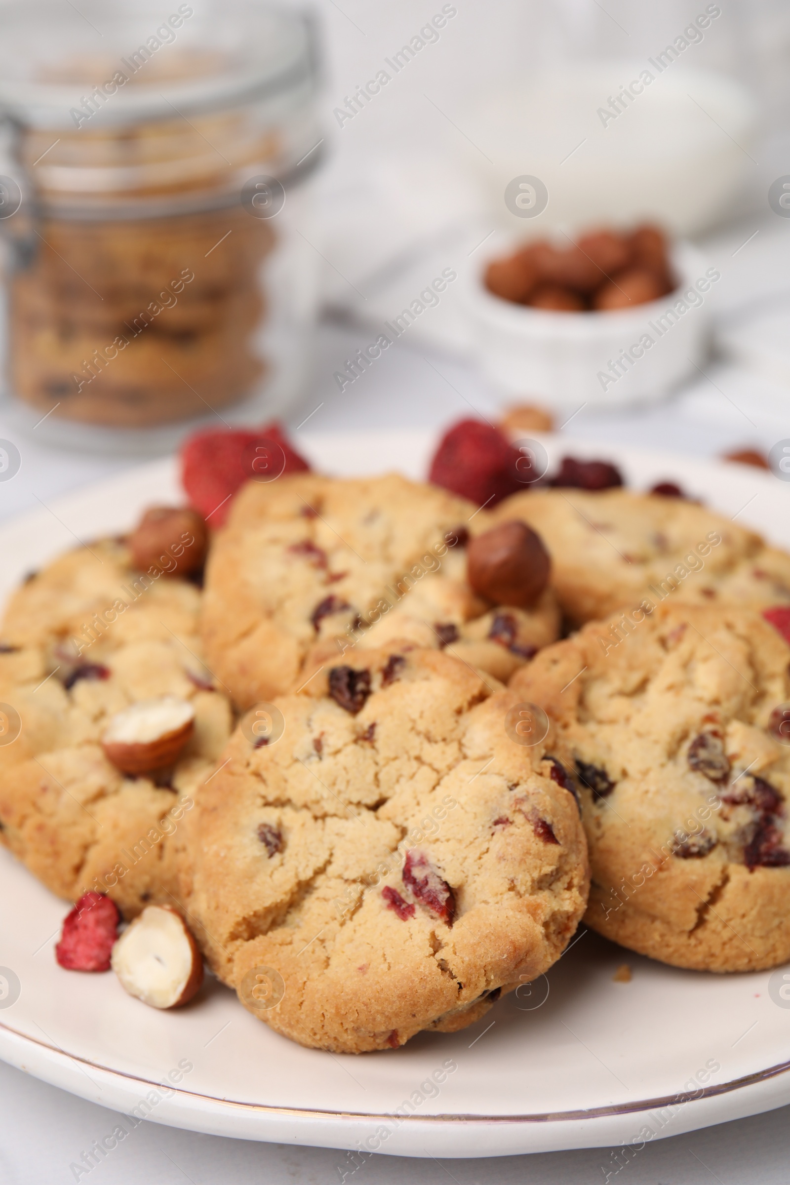 Cookies with freeze dried fruits and nuts on white table, closeup Photo of Cookies with freeze dried fruits and nuts on white table, closeup