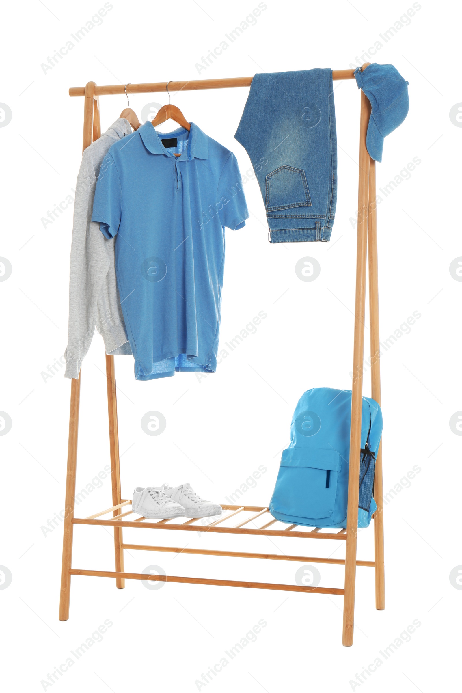 Photo of New wardrobe rack with stylish man's clothes and shoes on white background