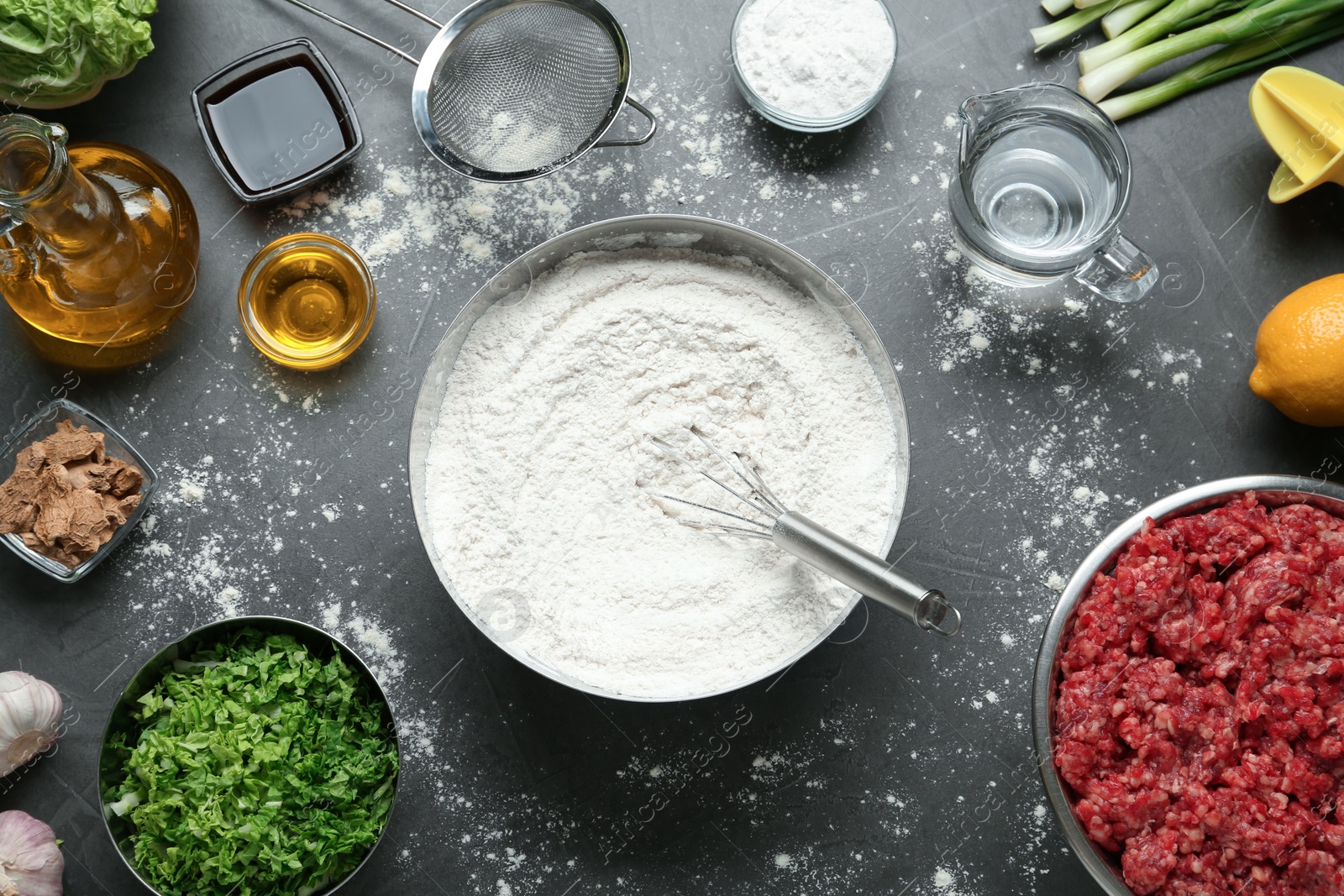 Photo of Flat lay composition with ingredients for gyoza on black table