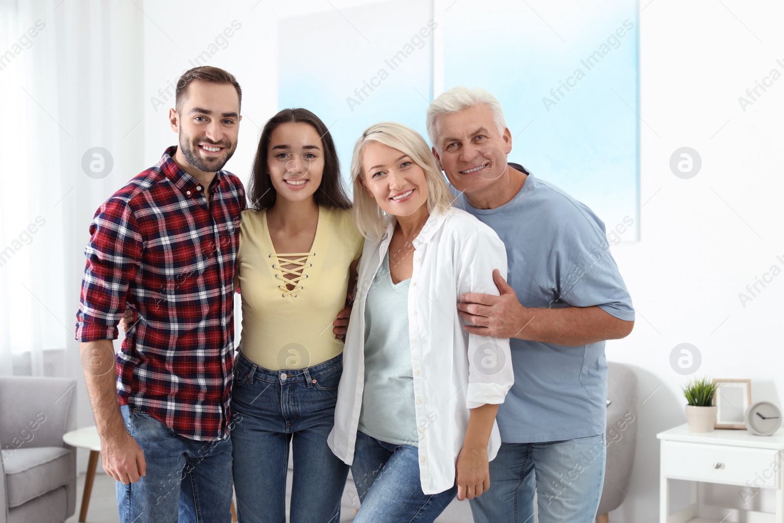 Photo of Portrait of happy family at home. Reunion of generations