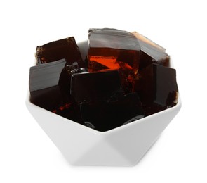 Photo of Delicious grass jelly cubes in bowl on white background