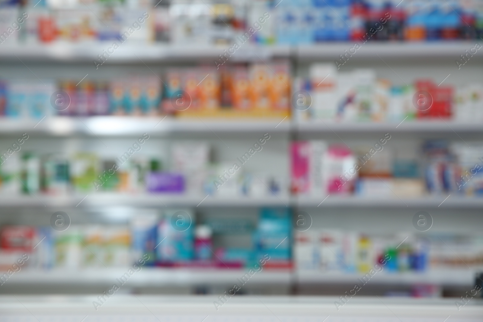 Photo of Blurred view of modern pharmacy interior with different medicine