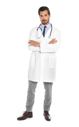 Photo of Young male doctor with stethoscope on white background. Medical service