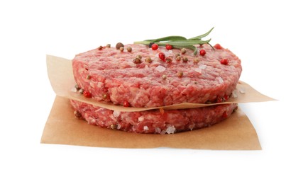 Photo of Raw hamburger patties with rosemary and spices on white background