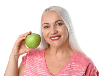 Photo of Smiling woman with perfect teeth and green apple on white background