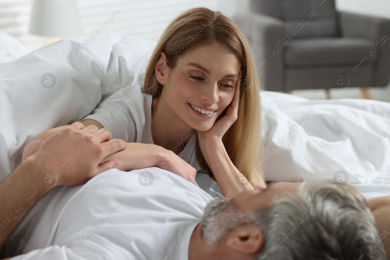 Photo of Lovely mature couple in bed at home