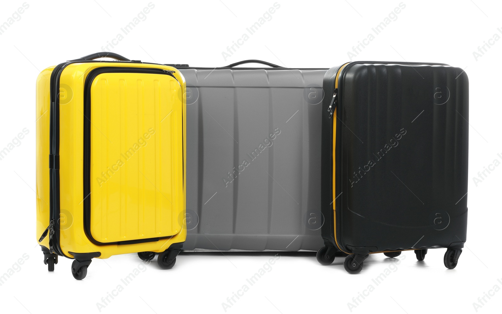 Photo of New suitcases packed for journey on white background