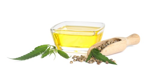 Photo of Hemp oil, fresh leaves and seeds on white background