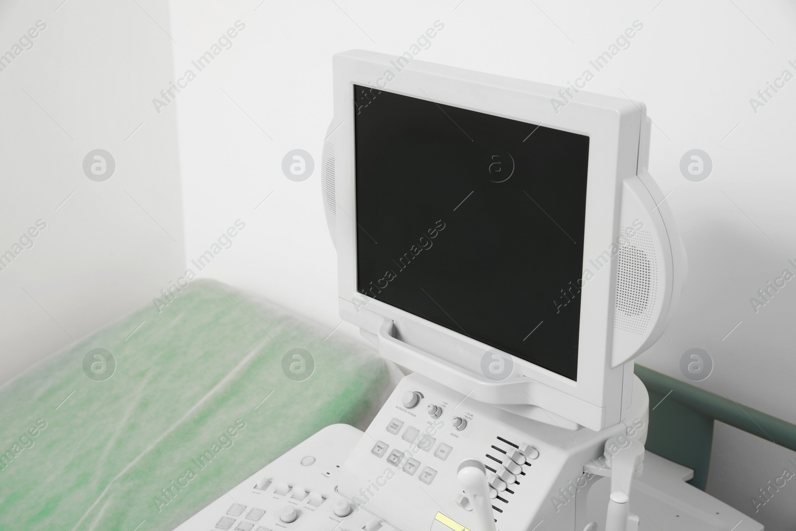 Photo of Ultrasound machine and examination table in hospital, closeup