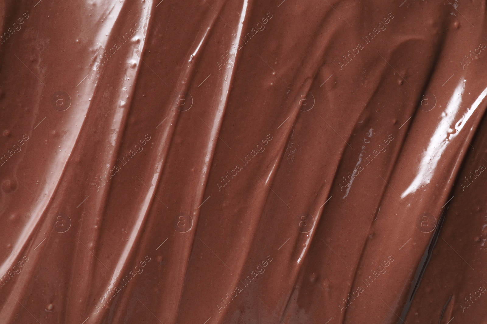 Photo of Tasty chocolate paste as background, closeup view