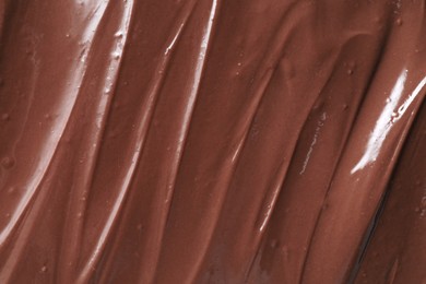 Tasty chocolate paste as background, closeup view