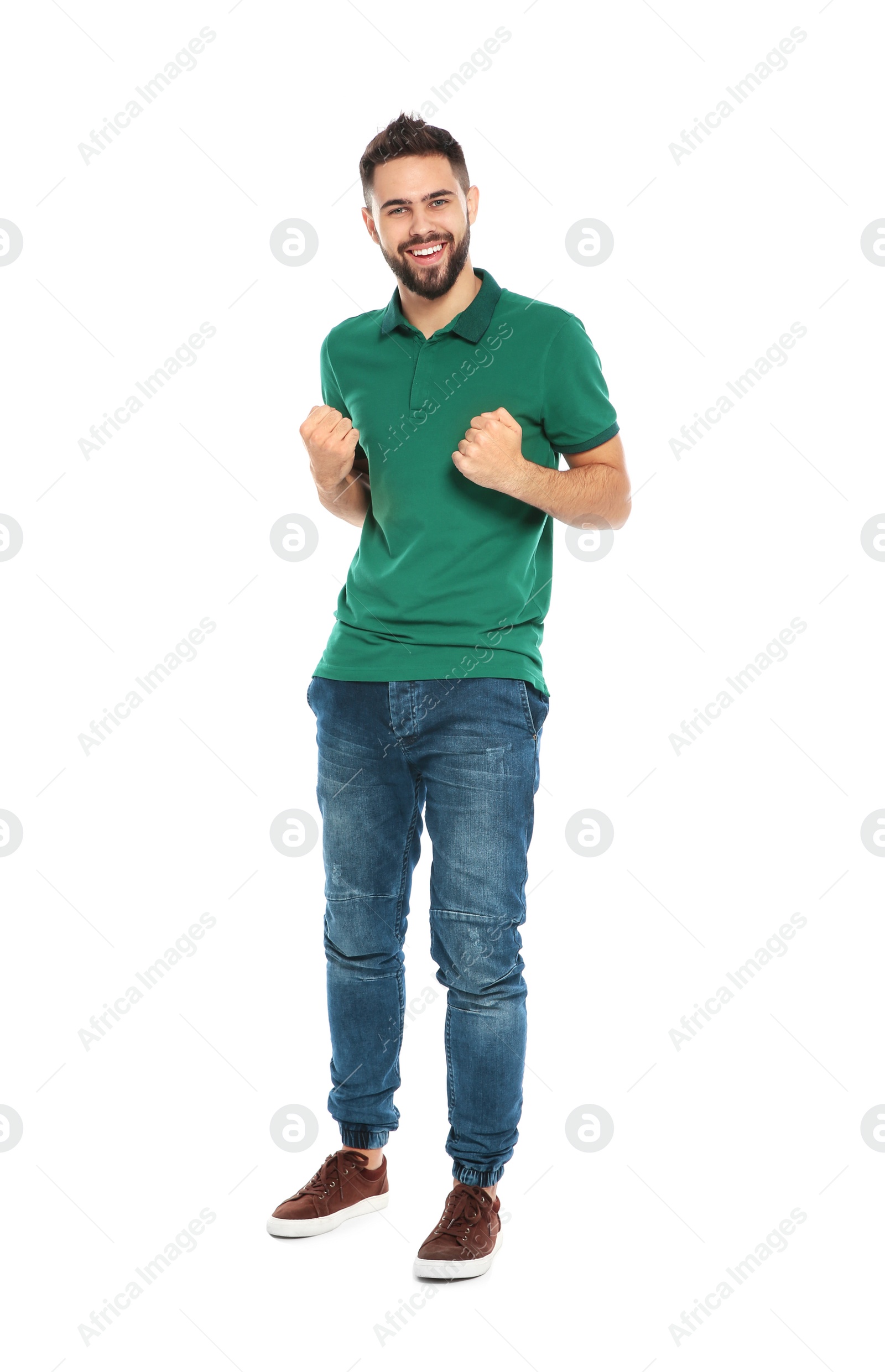 Photo of Happy young man celebrating victory on white background