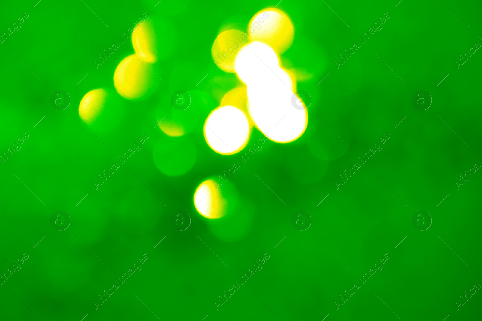 Image of St. Patrick day. Green background with blurred lights, bokeh effect