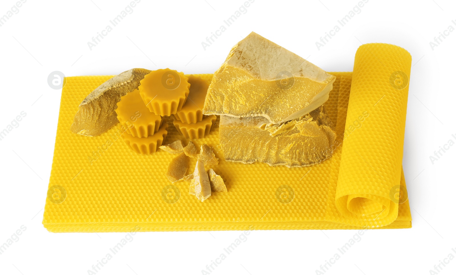 Photo of Different natural beeswax blocks and sheets on white background