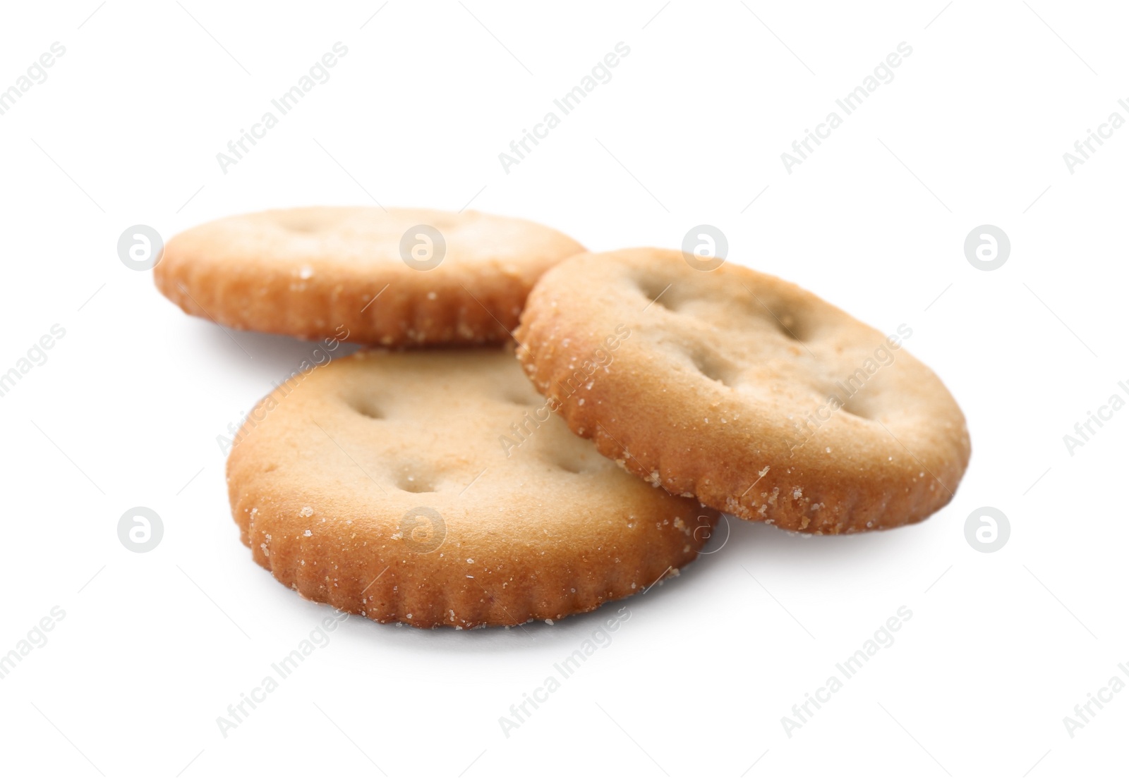 Photo of Crispy crackers isolated on white. Delicious snack