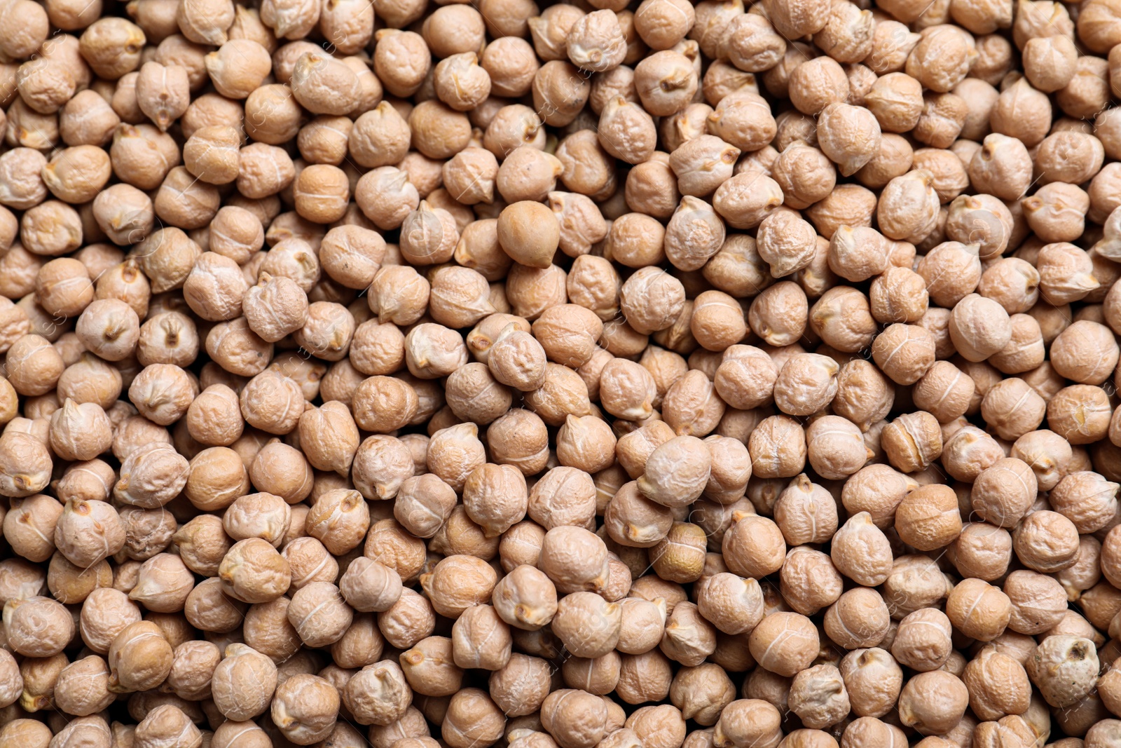 Photo of Many chickpeas as background, top view. Natural food