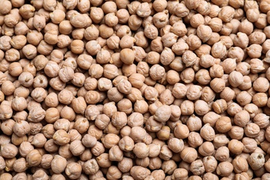 Photo of Many chickpeas as background, top view. Natural food