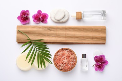 Flat lay composition with different spa products on white background