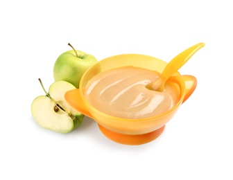 Photo of Bowl of healthy baby food and fresh apples on white background