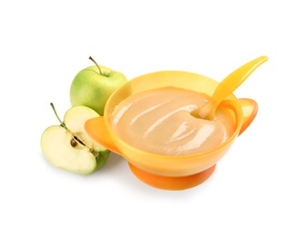 Bowl of healthy baby food and fresh apples on white background