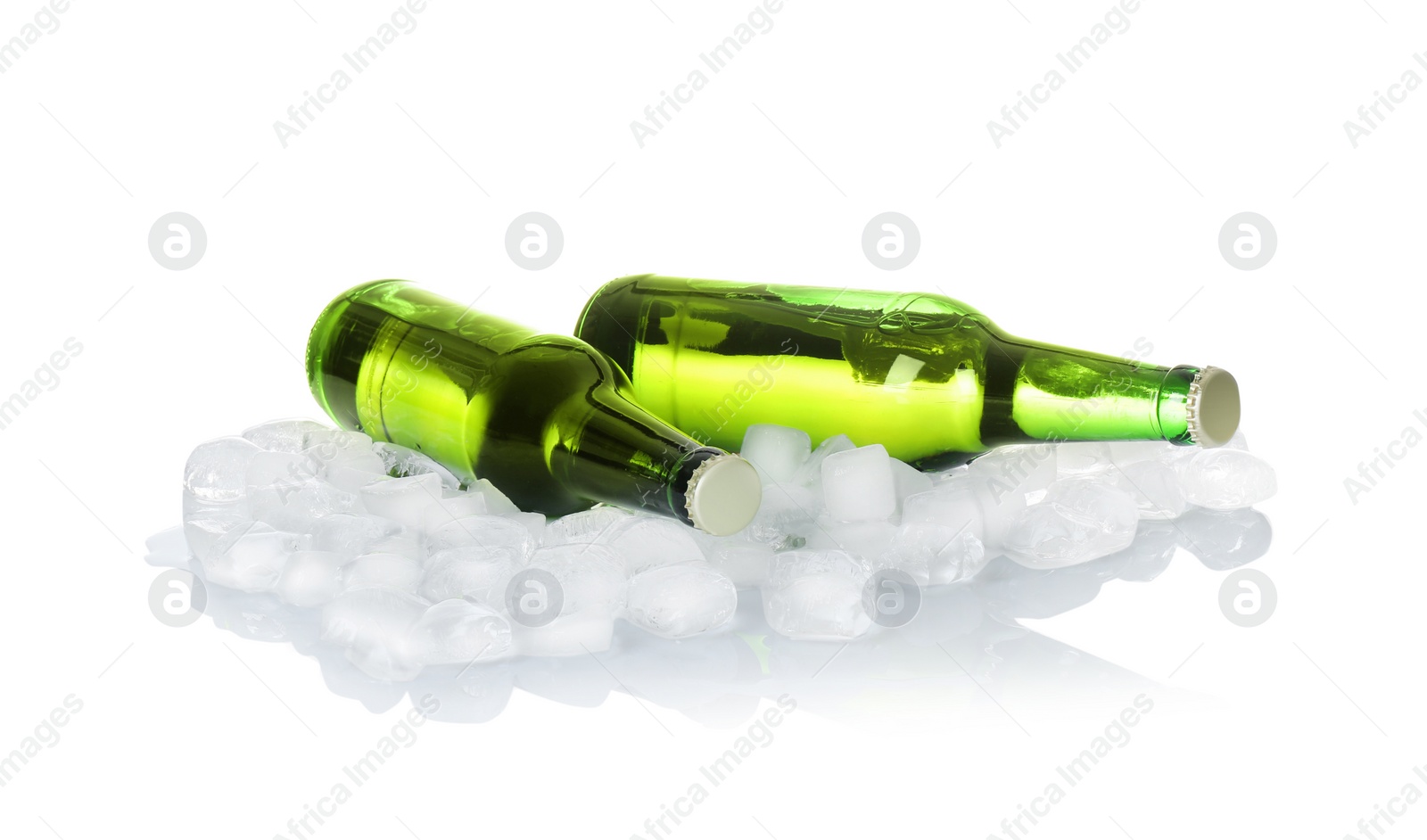 Photo of Bottles of beer and ice cubes on white background