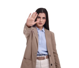 Beautiful young businesswoman in suit on white background