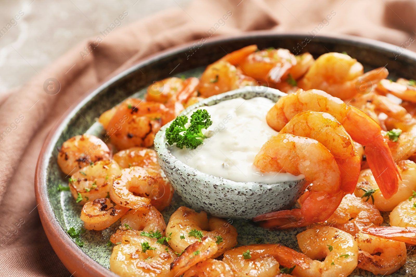 Photo of Plate with fried shrimps and sauce on table, closeup