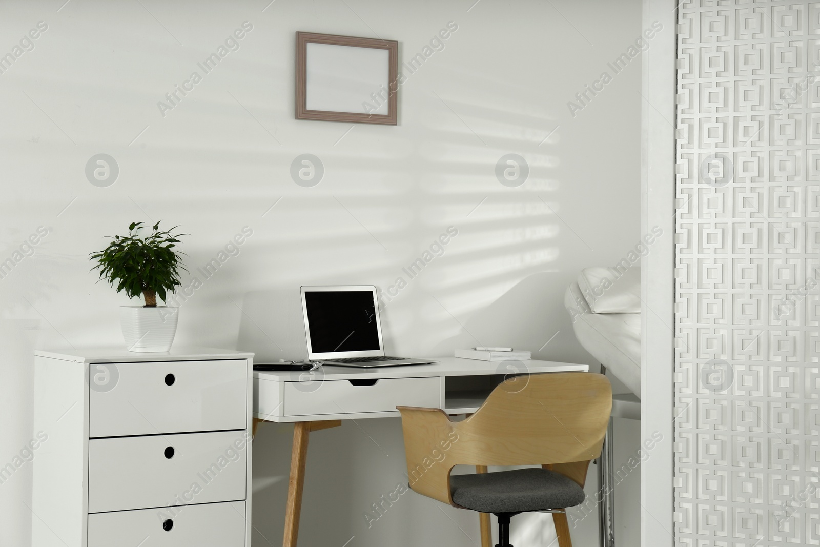 Photo of Doctor's workplace with laptop in modern clinic