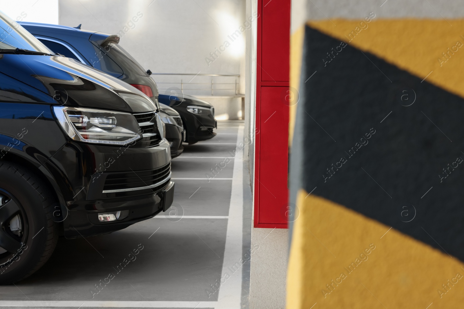 Photo of Outdoor parking lot with cars on sunny day