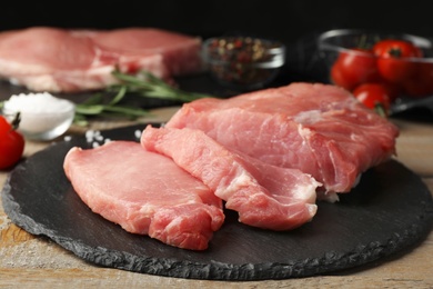 Photo of Fresh raw cut meat on slate plate