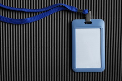 Blank badge on black background, top view. Mockup for design