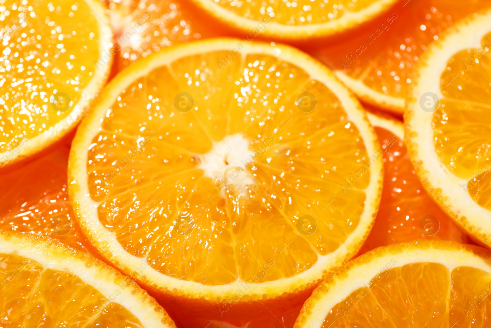 Photo of Slices of juicy orange as background, closeup