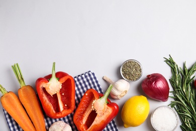 Flat lay composition with ingredients for cooking on white background. Space for text