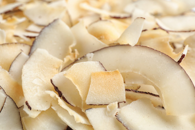 Photo of Delicious fresh coconut chips as background, closeup