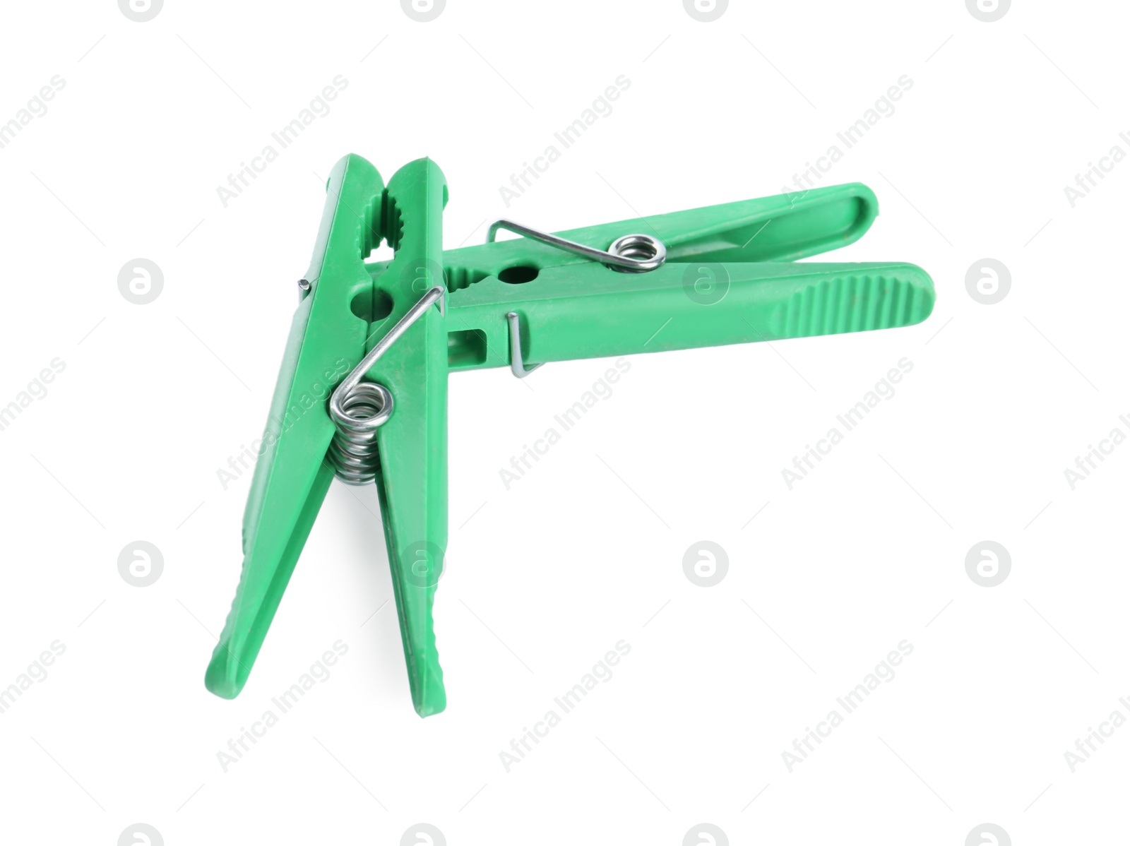 Photo of Bright green plastic clothespins on white background