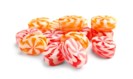 Pile of delicious colorful candies on white background