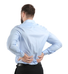 Young man suffering from back pain on white background