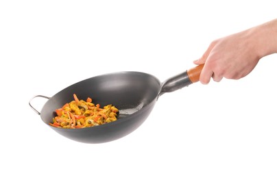 Photo of Stir-fry. Woman holding wok with cooked vegetables and chicken on white background, closeup