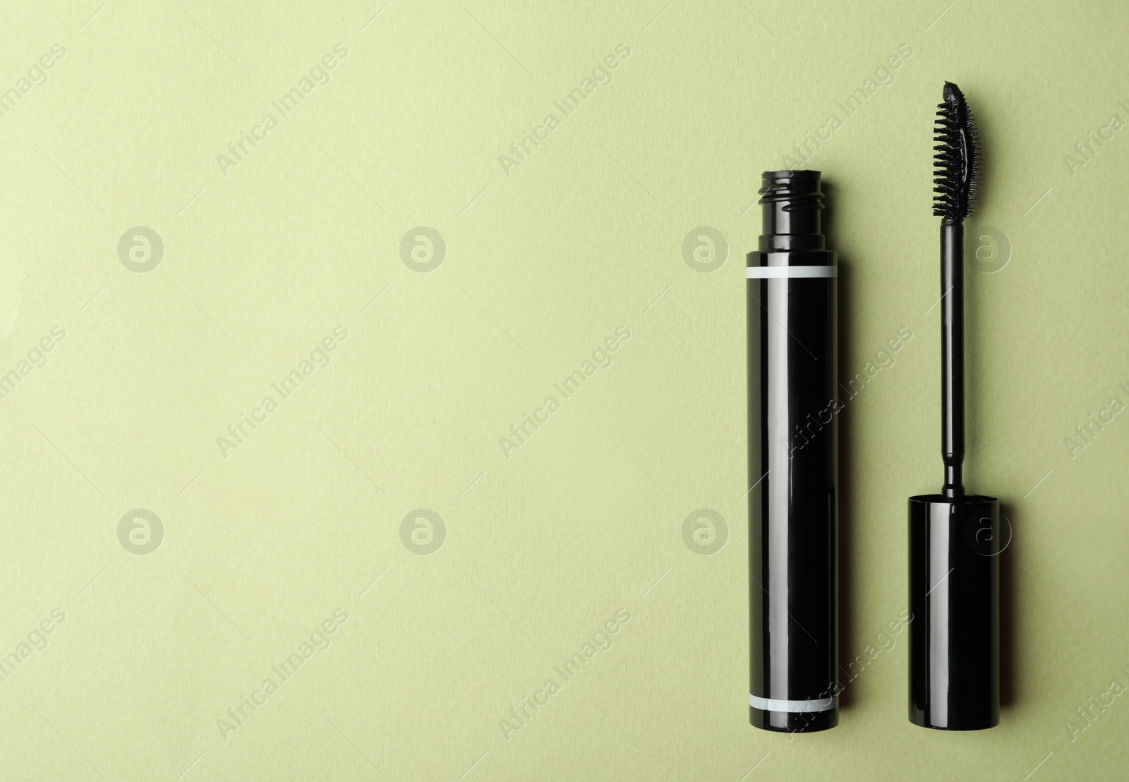 Photo of Mascara on light background, flat lay with space for text. Makeup product