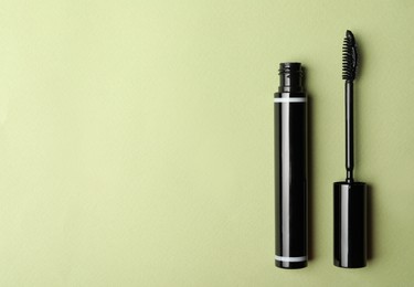 Mascara on light background, flat lay with space for text. Makeup product