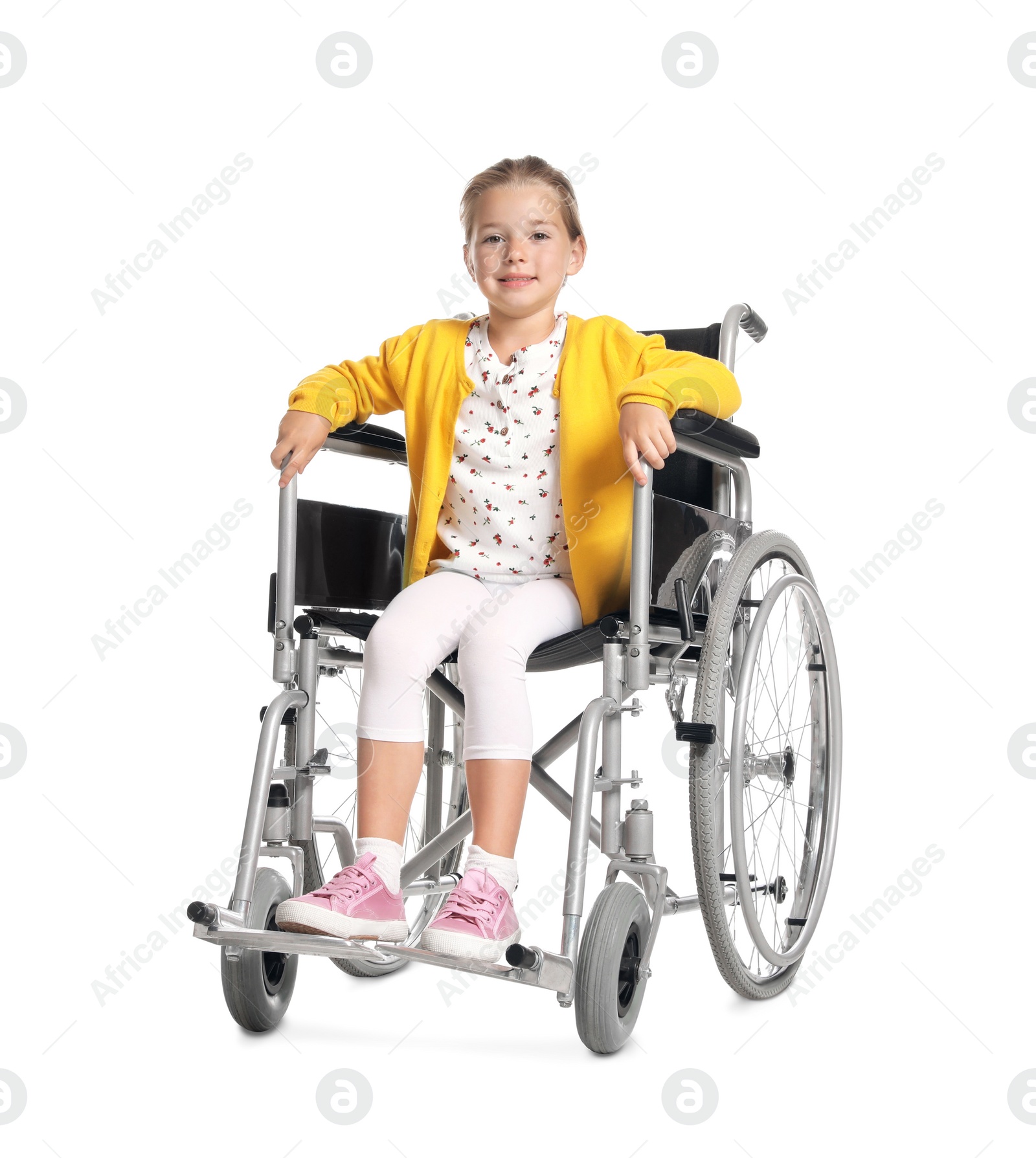 Photo of Little girl in wheelchair on white background