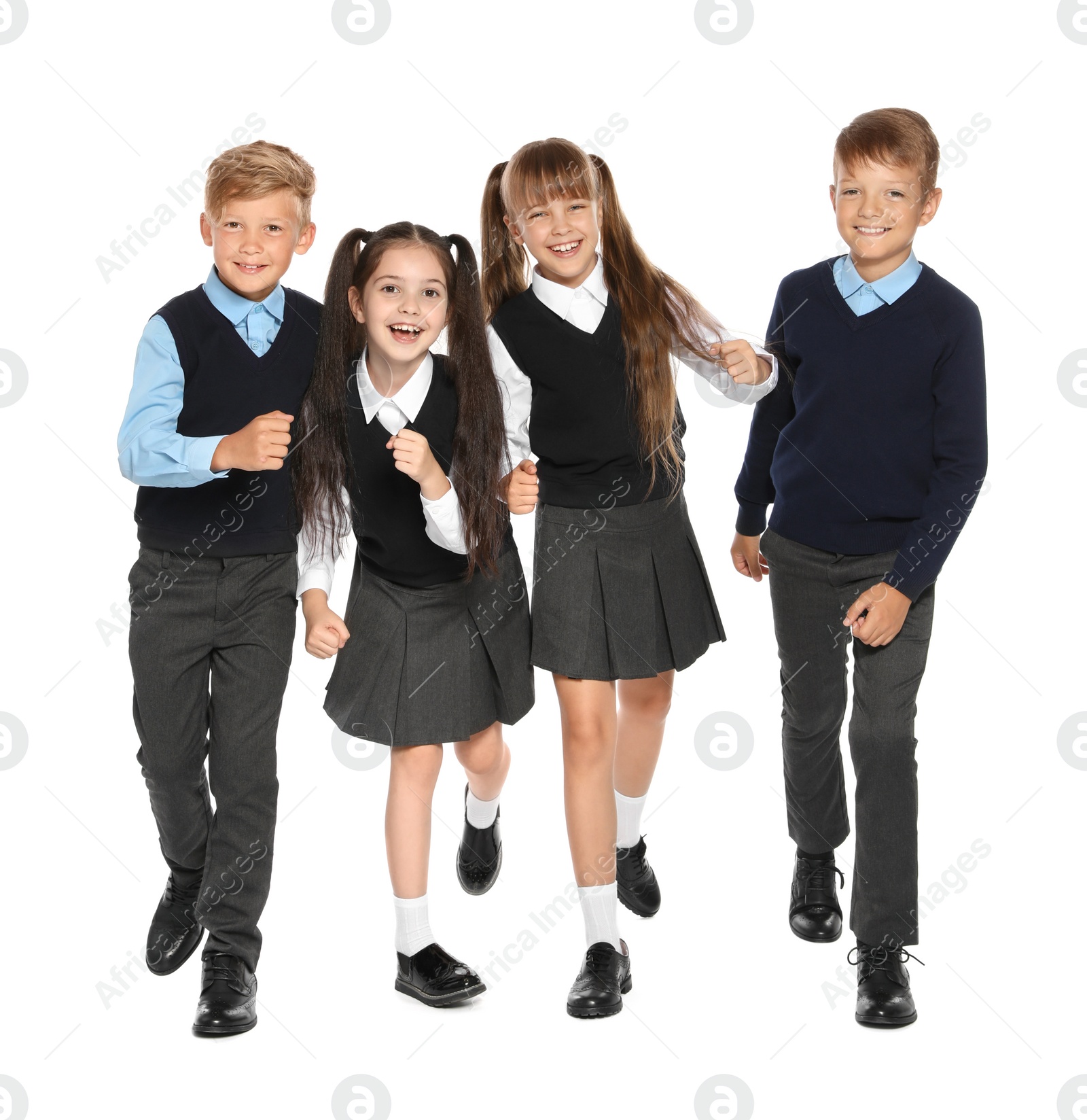 Photo of Little children in stylish school uniform on white background