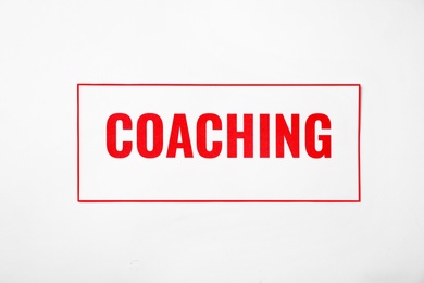 Word COACHING on white background. Business trainer concept