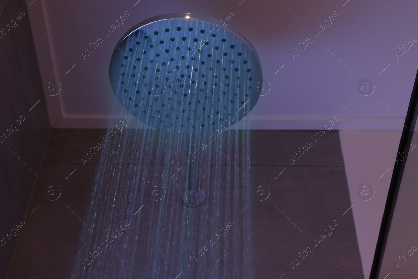 Photo of Luxury shower with water flowing in bathroom