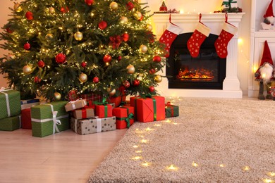 Living room interior with fireplace and festive decor. Christmas celebration