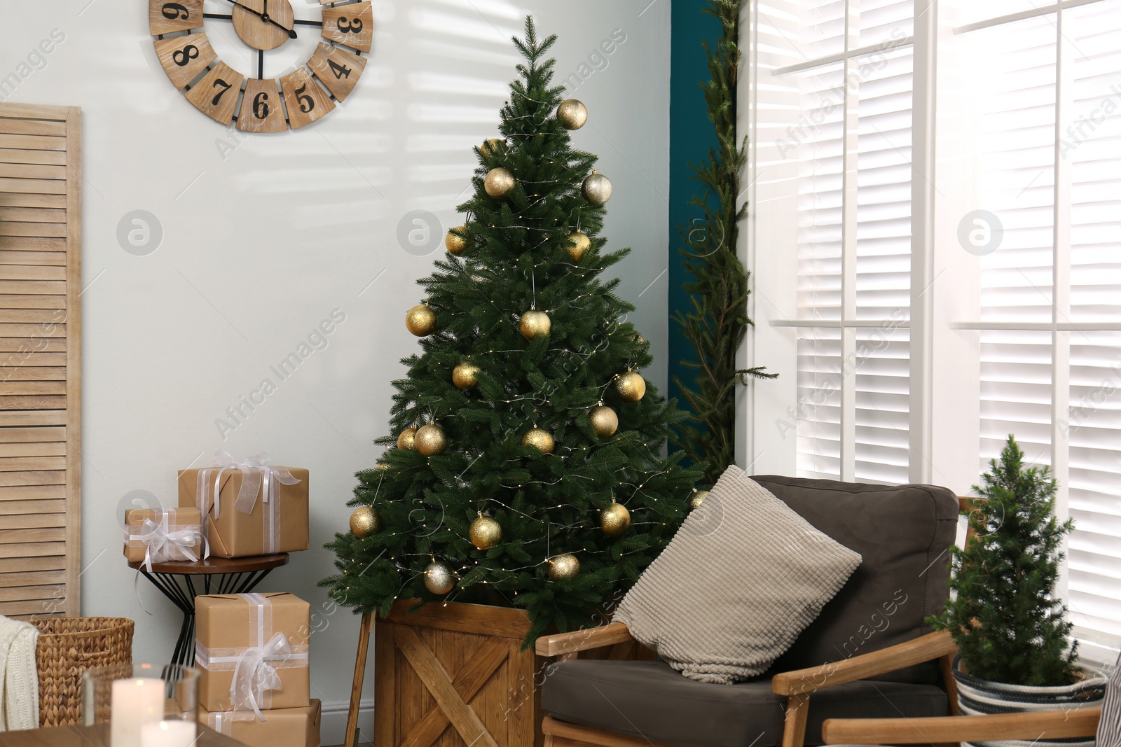 Photo of Beautiful decorated Christmas tree in living room