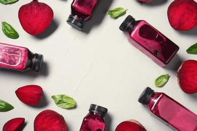 Flat lay composition with beet smoothies on light background. Space for text