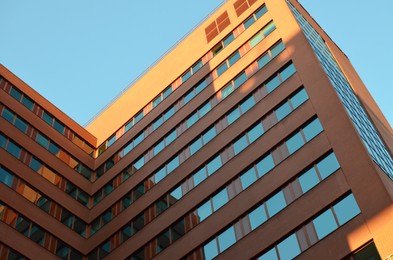Modern building against blue sky, low angle view