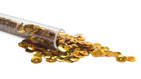 Many golden sequins and tube on white background